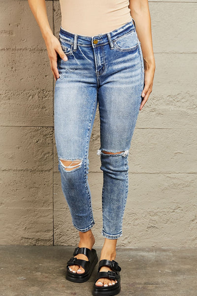 Medium / 24 Mid Rise Distressed Skinny Jeans